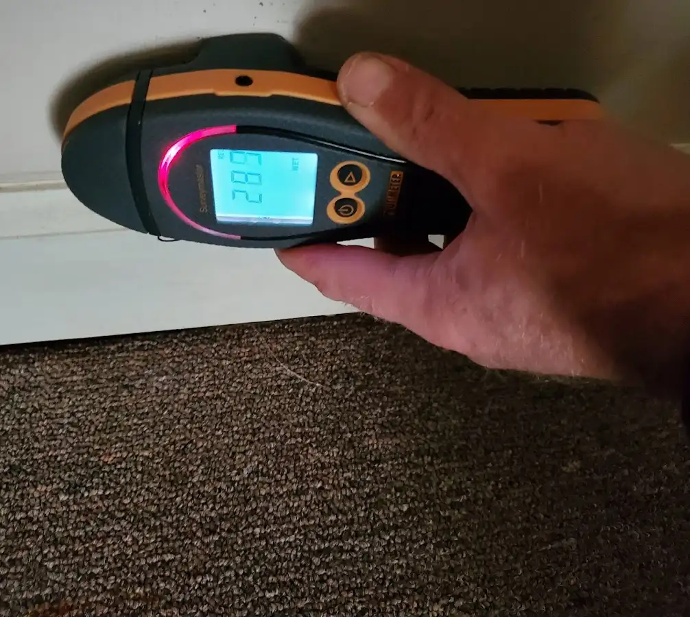 Moisture detection at baseboard during Storm Damage Restoration in Lehi